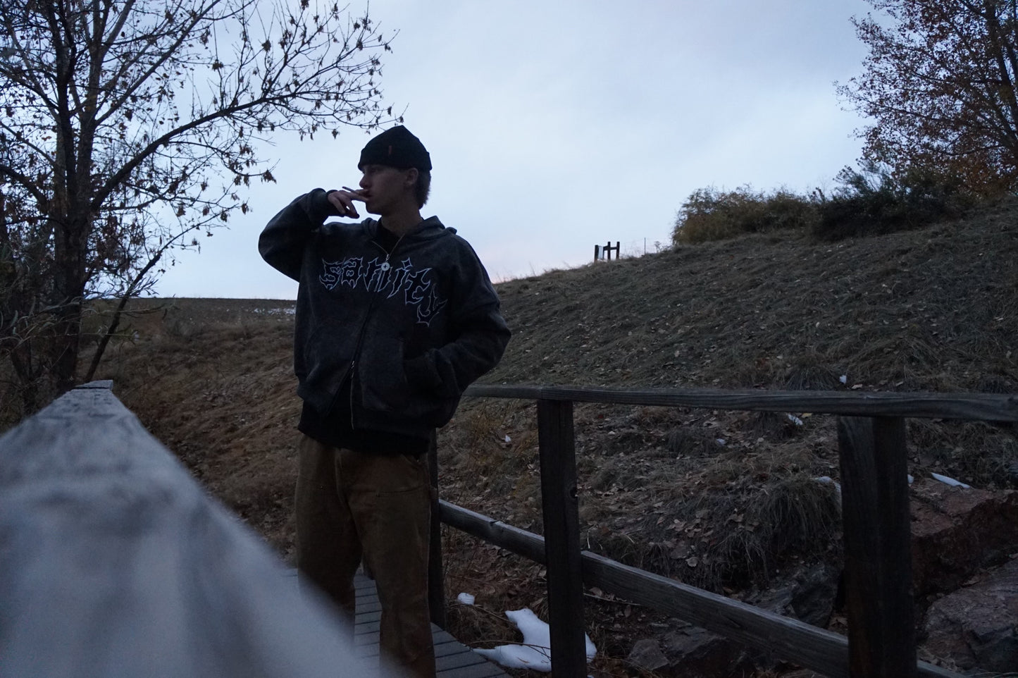 Model wearing stone zip-up hoodie, size XL fit demonstration