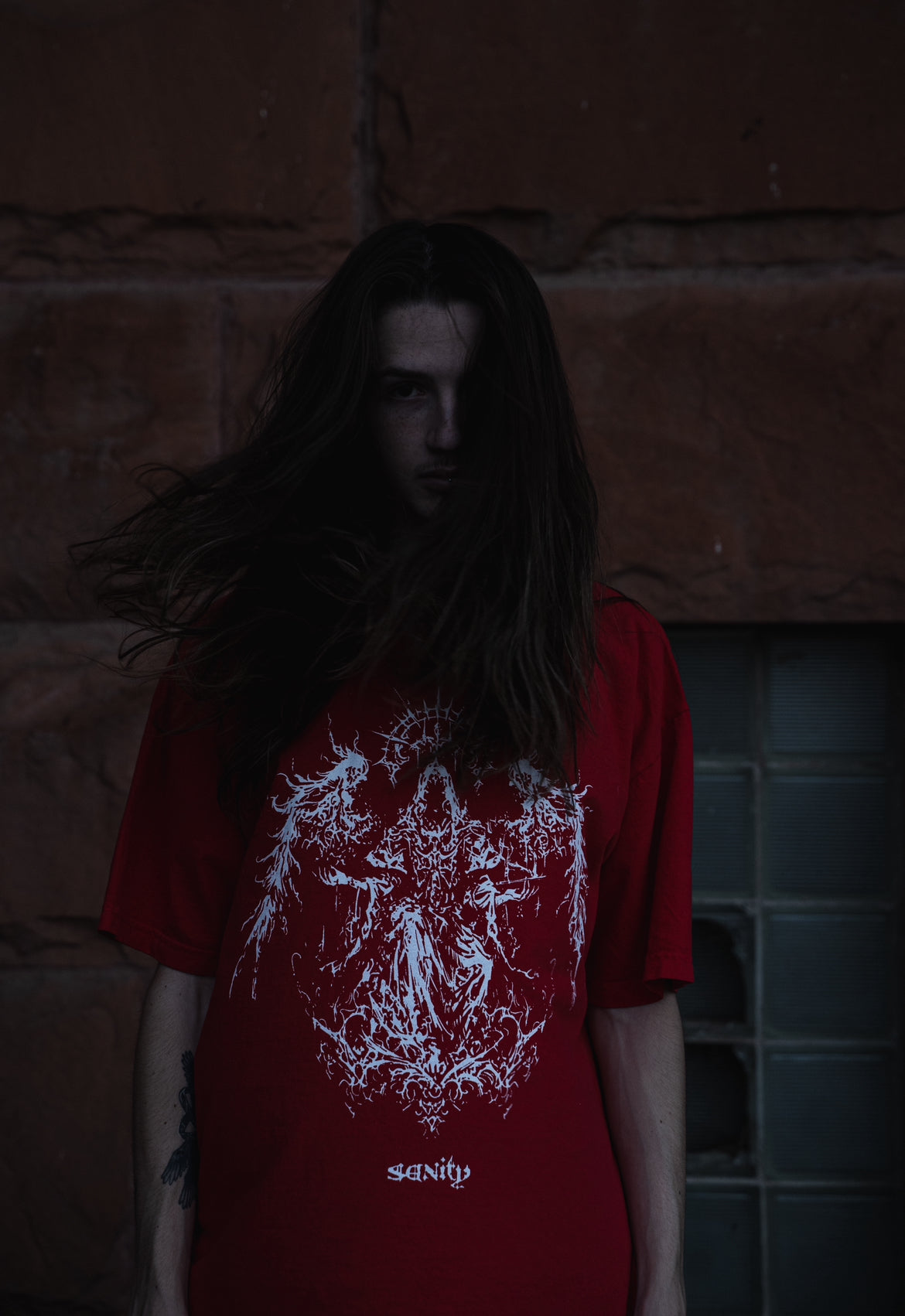 Model wearing red Spirits t-shirt, size XL fit demonstration