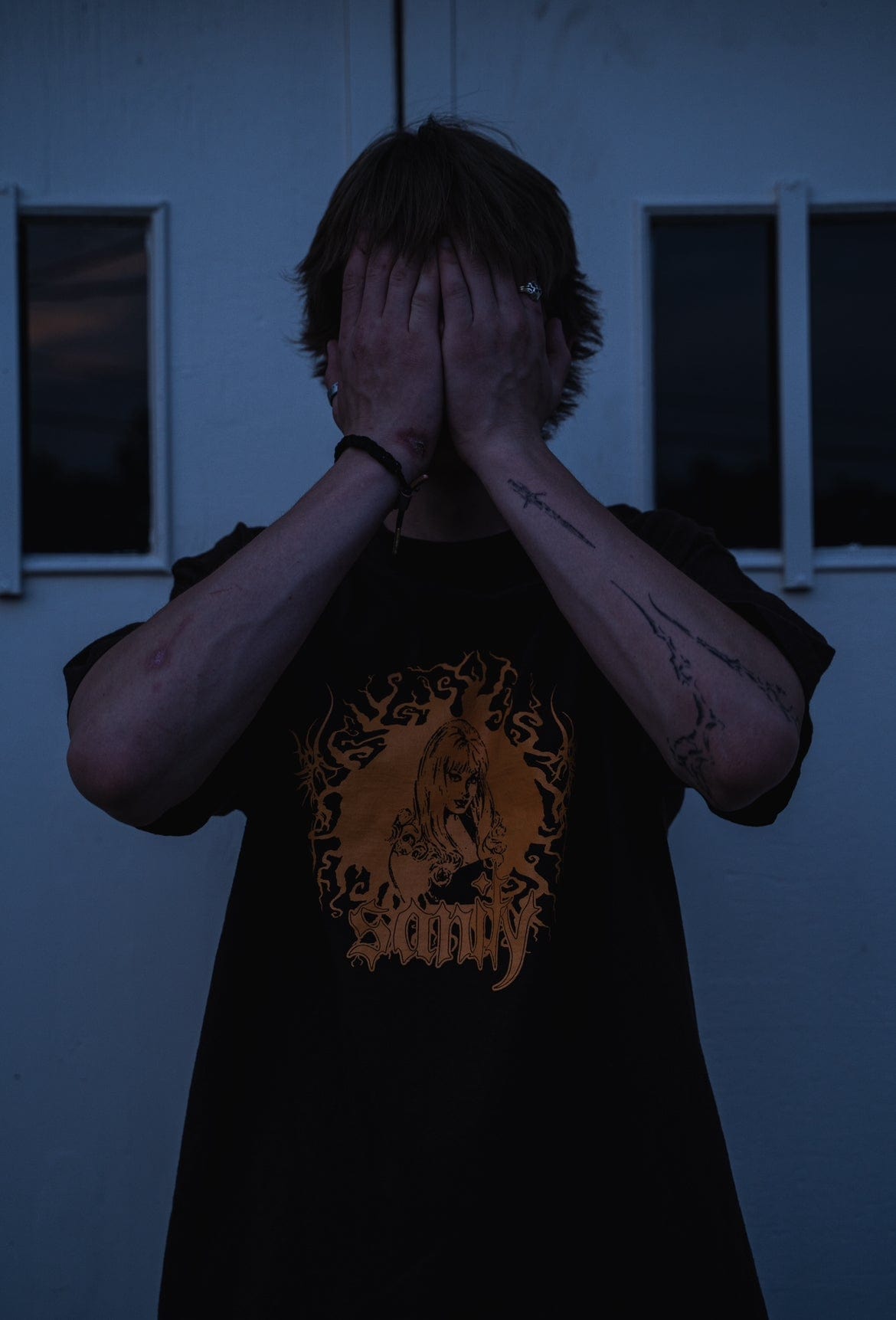 Model wearing brown GIRL t-shirt, size large fit demonstration