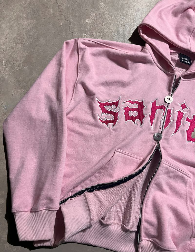 Rose zip-up hoodie showing double star zipper and cropped fit