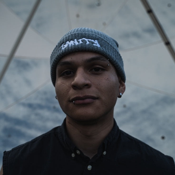 Grey essential beanie showing comfortable short profile design